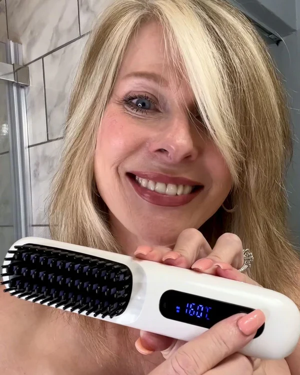 Happy customer holding GoBrush Pro